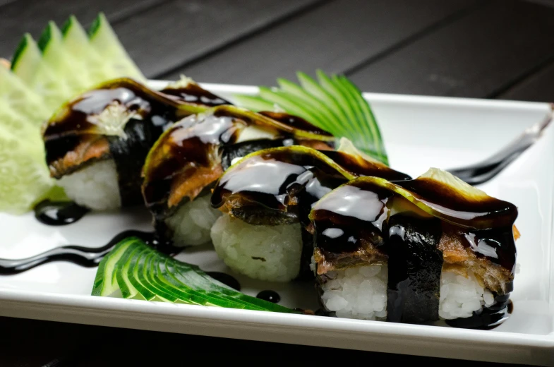 a close up of a plate of food on a table, inspired by Maki Haku, black ooze, sleek spines, brown, profile image