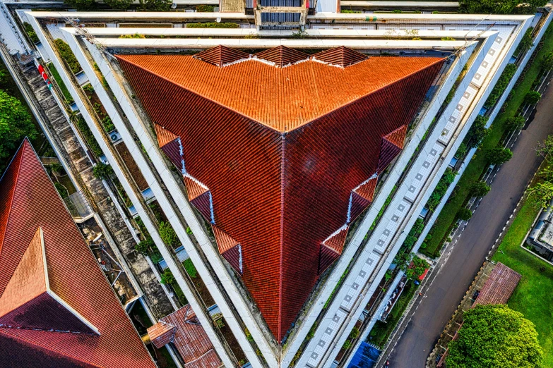 an aerial view of a building with a red roof, pexels contest winner, intricate triangular designs, south jakarta, square, shot on sony a 7