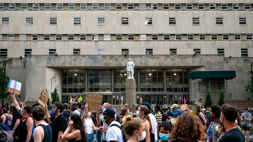 a crowd of people standing in front of a building, a photo, by Dan Frazier, renaissance, statue, protest, 2 0 2 2 photo, getty images