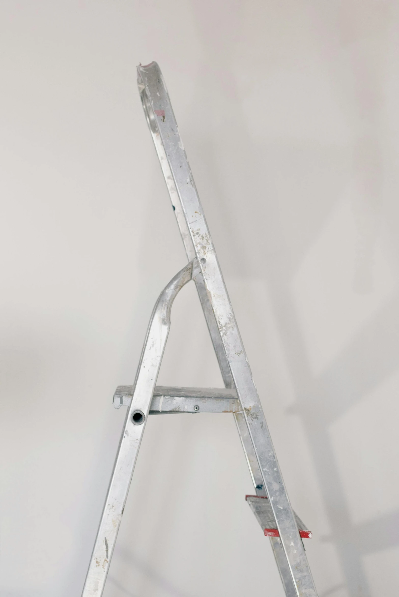 a ladder leaning up against a white wall, by Doug Ohlson, arte povera, aluminium, artist unknown, 15081959 21121991 01012000 4k, semi realistic