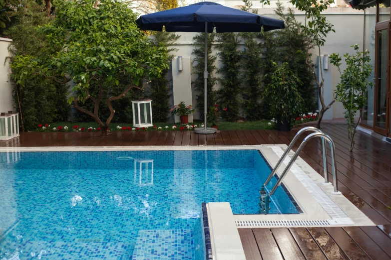 a pool in a backyard with a blue umbrella, a mosaic, pexels contest winner, square, hotel room, premium quality, brown