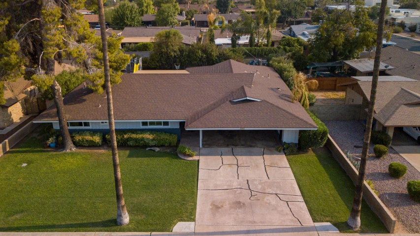 a house sitting on top of a lush green field, a portrait, featured on reddit, 1600 south azusa avenue, top down angle, driveway, 15081959 21121991 01012000 4k