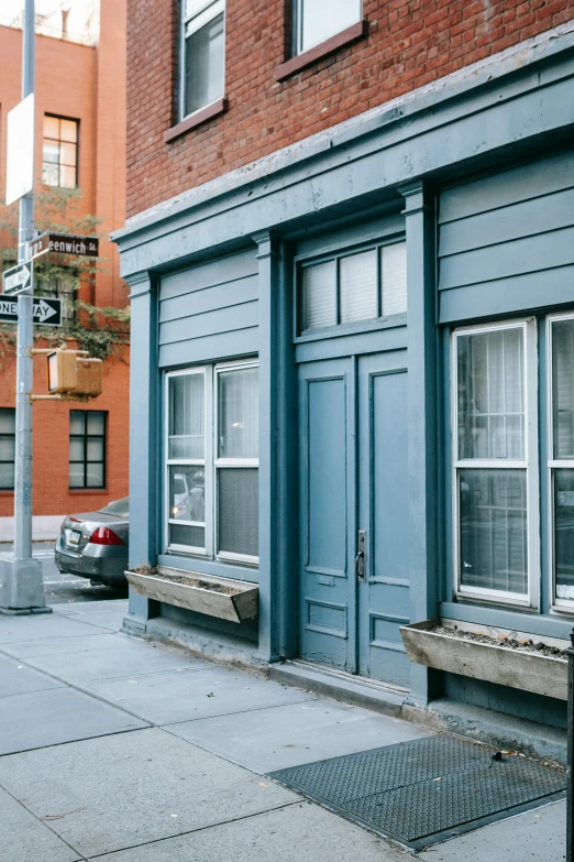 a parking meter sitting on the side of a street, by Nina Hamnett, trending on unsplash, blue shutters on windows, 1 9 2 0 s brooklyn, modern lush condo as shopfront, doorway
