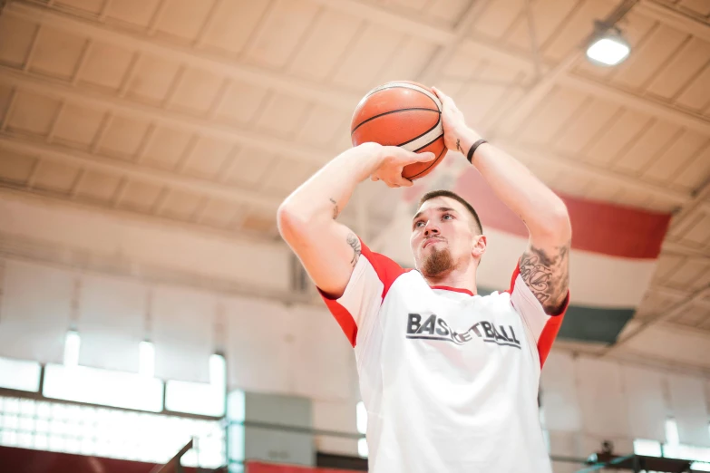 a man holding a basketball on top of a basketball court, by Paul Bird, trending on dribble, 15081959 21121991 01012000 4k, headshot profile picture, jakub gazmercik, mid action swing