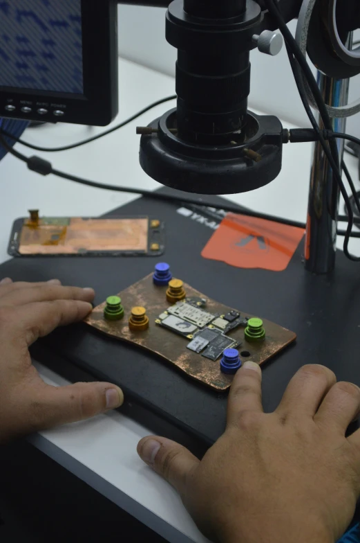 a close up of a person using a computer mouse, an etching, by Alejandro Obregón, assemblage, in a lab, octa 8k, engineering bay, india