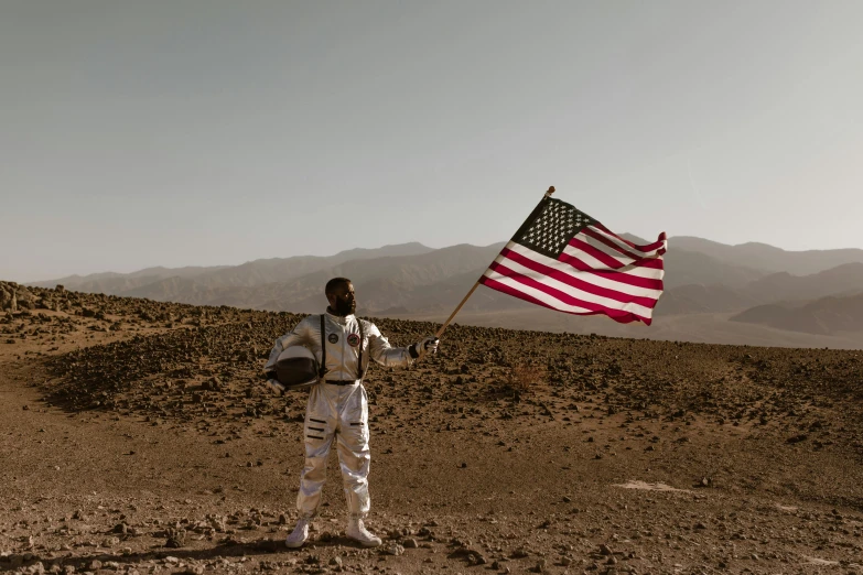 a man in a spacesuit holding an american flag, pexels contest winner, mars vacation photo, brown, instagram post, music video