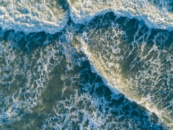 an aerial view of a body of water, by Carey Morris, pexels, waves crashing, detailed high resolution, flattened, cinematic image