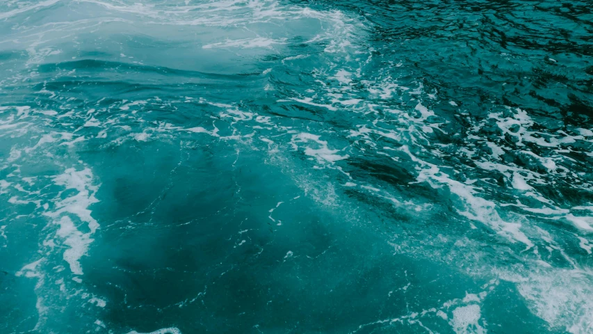 a person riding a surfboard on top of a body of water, deep in the ocean, monochromatic teal, whirlpool, blue veins