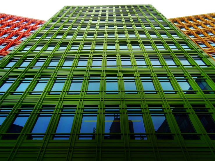 a very tall building with a lot of windows, a digital rendering, by Werner Gutzeit, pexels contest winner, vibrant green, iron cladding, color slide, square