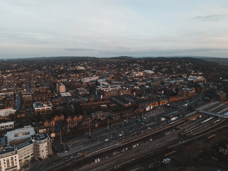 an aerial view of a city at dusk, unsplash, barnet, brown, aerial footage, mid shot photo