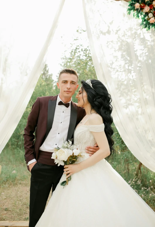 a man in a tuxedo standing next to a woman in a wedding dress, pexels contest winner, ukraine. professional photo, canopies, handsome man, brown