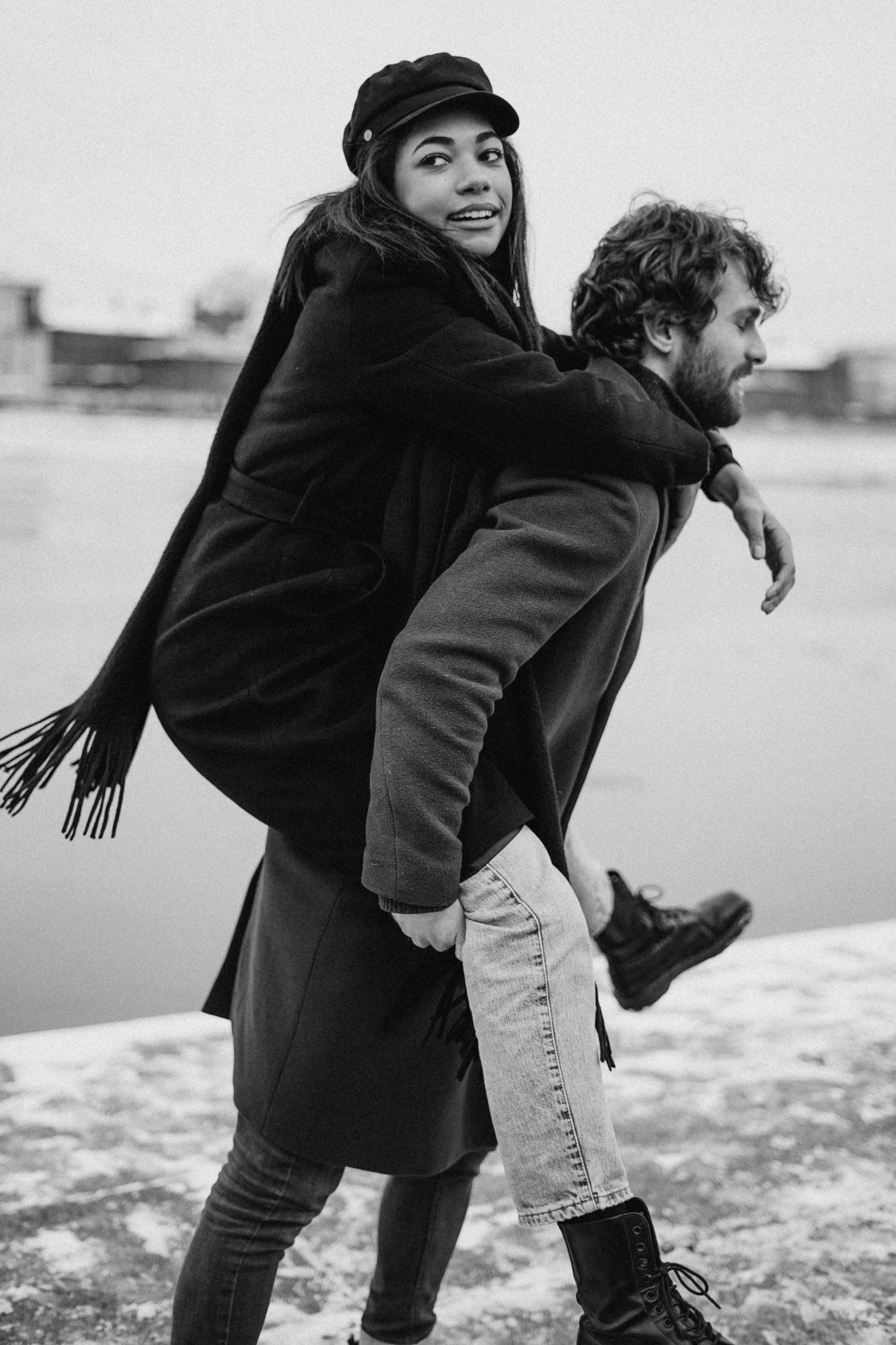 a man carrying a woman on his back, a black and white photo, by Anita Malfatti, pexels contest winner, cold weather, knight of cups, style of jesper ejsing, large)}]