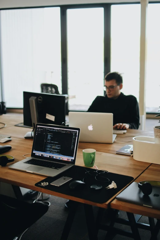 a group of people sitting at a table with laptops, by Sebastian Vrancx, trending on unsplash, a python programmer's despair, behance lemanoosh, sitting on a desk, bulky build