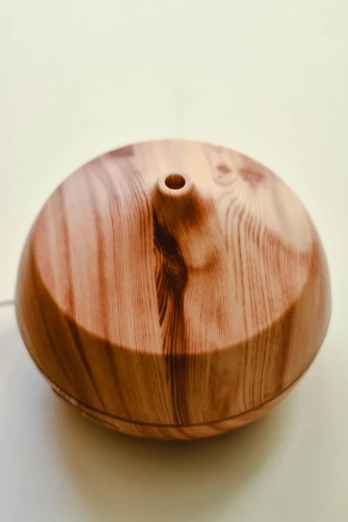 a wooden bowl sitting on top of a table, misting, neck zoomed in, product image, nice face