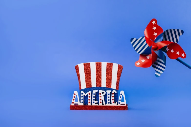 a red, white and blue top hat with a pinwheel, by Bernie D’Andrea, shutterstock contest winner, pop up parade figure, billboard image, avatar image, sephora