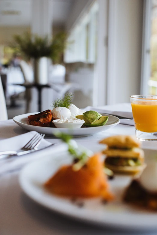 a close up of a plate of food on a table, by Julian Allen, unsplash, table set for second breakfast, lush vista, swedish, crisp smooth clean lines