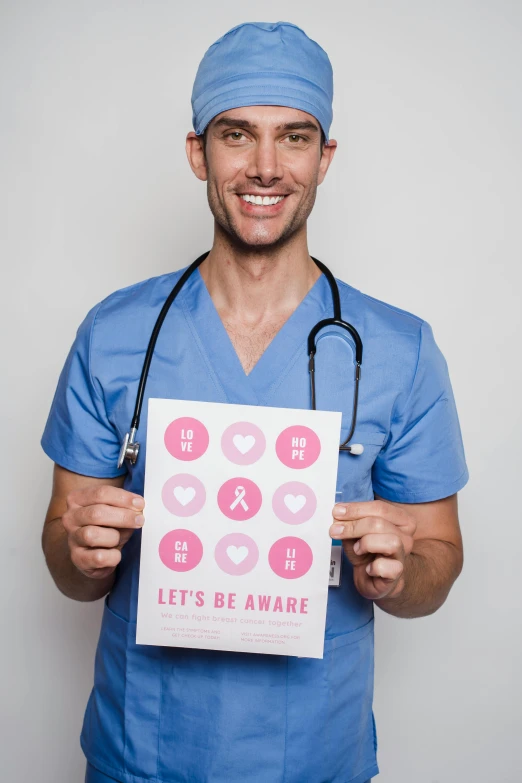 a man in scrubs holding a sign that says let's be aware, poster art, pexels contest winner, an attractive, pr shoot, hearts, profile picture