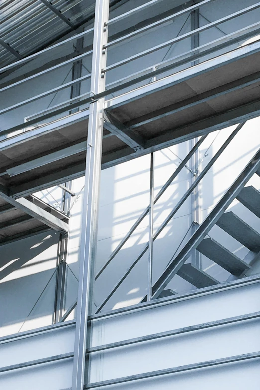 a metal staircase going up the side of a building, a digital rendering, inspired by Tadao Ando, promo image, steel window mullions, thumbnail, quality