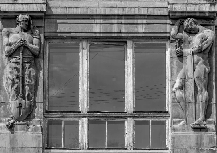 a couple of statues on the side of a building, an art deco sculpture, pexels contest winner, art nouveau, room mono window, dieselpunk volgograd, memphis, slightly muscular