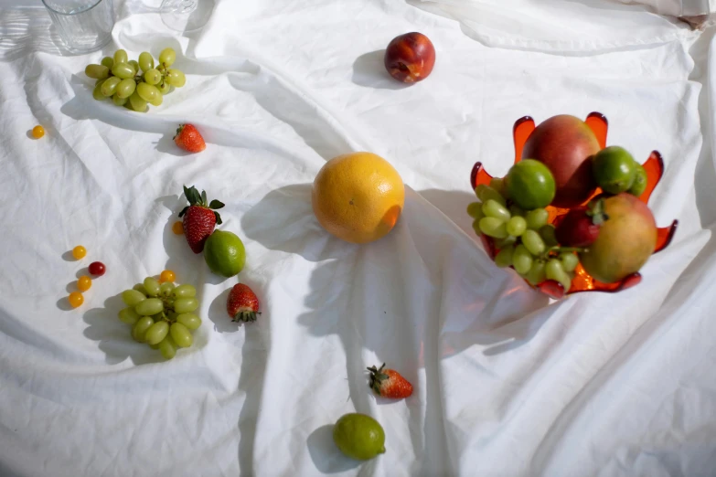 a close up of a bowl of fruit on a table, unsplash, hyperrealism, white tablecloth, background image, 2 0 0 0's photo