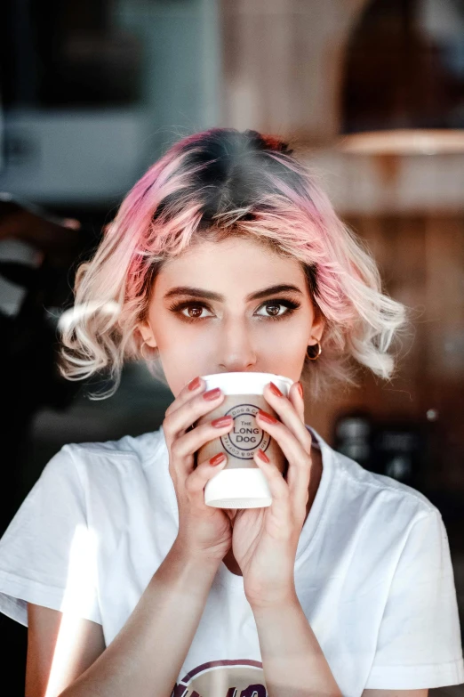 a woman with pink hair drinking a cup of coffee, a colorized photo, inspired by Elsa Bleda, trending on pexels, perfect white haired girl, extremely high contrast, (pink colors), girls
