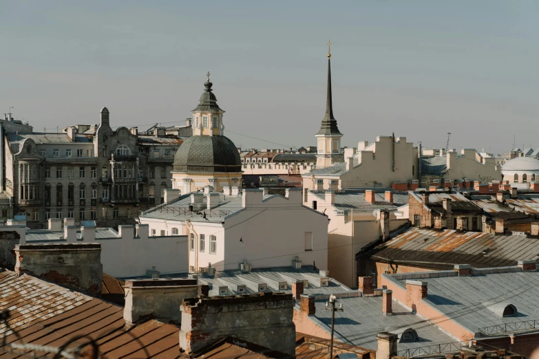 a view of a city from the top of a building, by Emma Andijewska, pexels contest winner, baroque, rounded roof, neo kyiv, afternoon light, three views