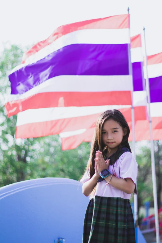 a little girl standing in front of an american flag, by Bernardino Mei, unsplash, symbolism, thai temple, ((purple)), school, square