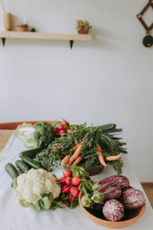 a table topped with lots of different types of vegetables, by Jessie Algie, unsplash, in a kitchen, dwell, full protrait, barbara canepa