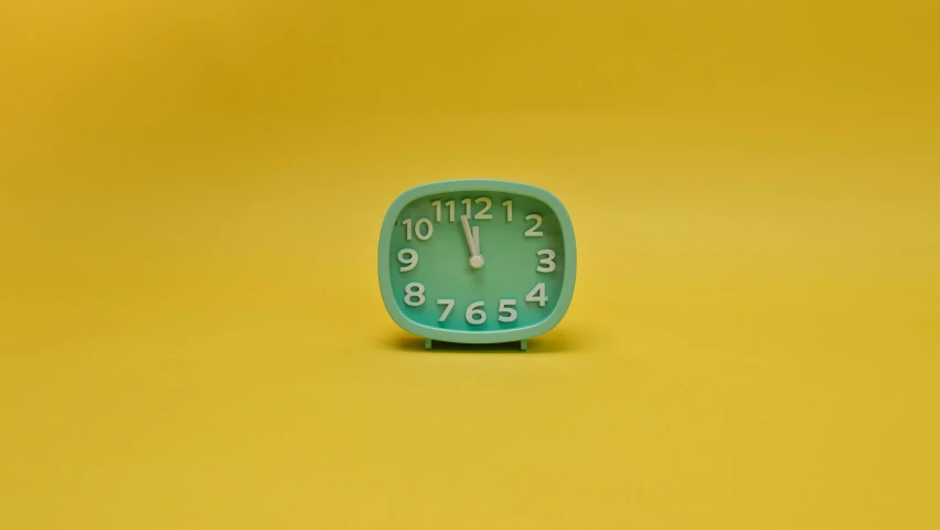 a green clock sitting on top of a yellow surface, inspired by Wes Anderson, trending on unsplash, square, blueish, alarm clock, animation style render
