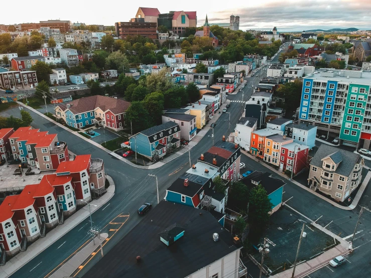 a view of a city from the top of a building, colorful houses, quebec, fan favorite, high res 8k