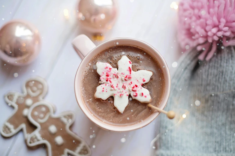 a close up of a cup of hot chocolate, by Julia Pishtar, snowflakes, pink pastel, instagram post, background image