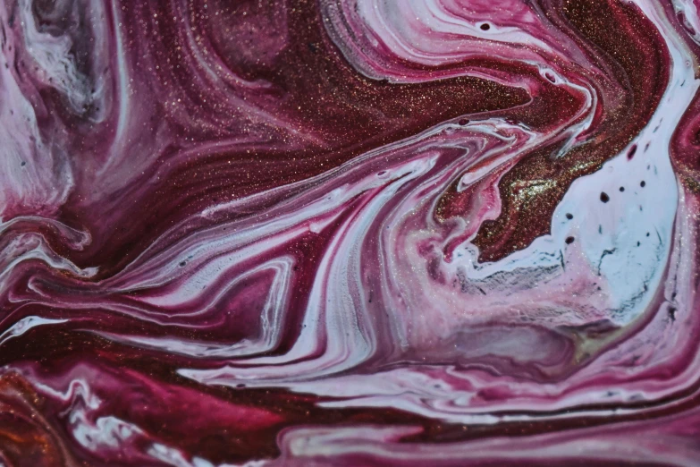 a close up of a liquid painting on a surface, inspired by Tintoretto, trending on pexels, maroon and white, galactic, magenta