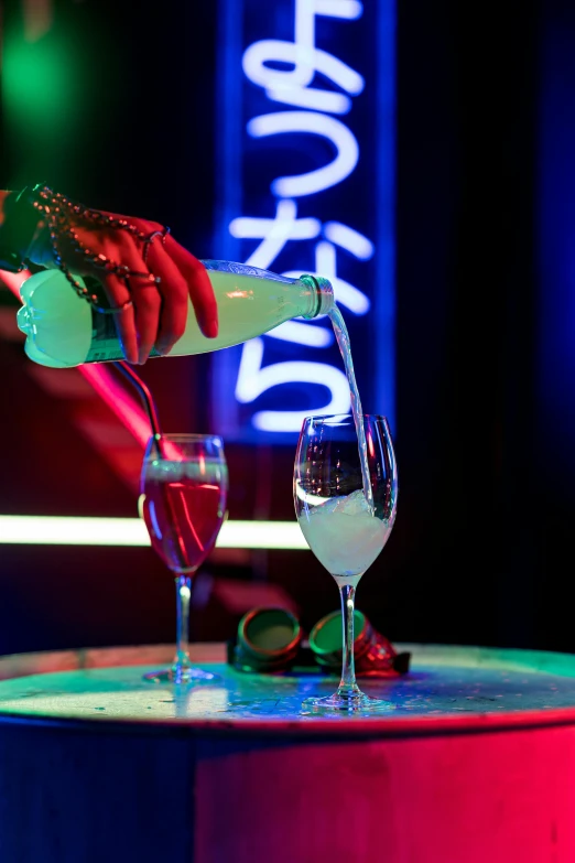 a person pouring a drink into a glass, neon tokyo, themed after wine, champagne on the table, press shot