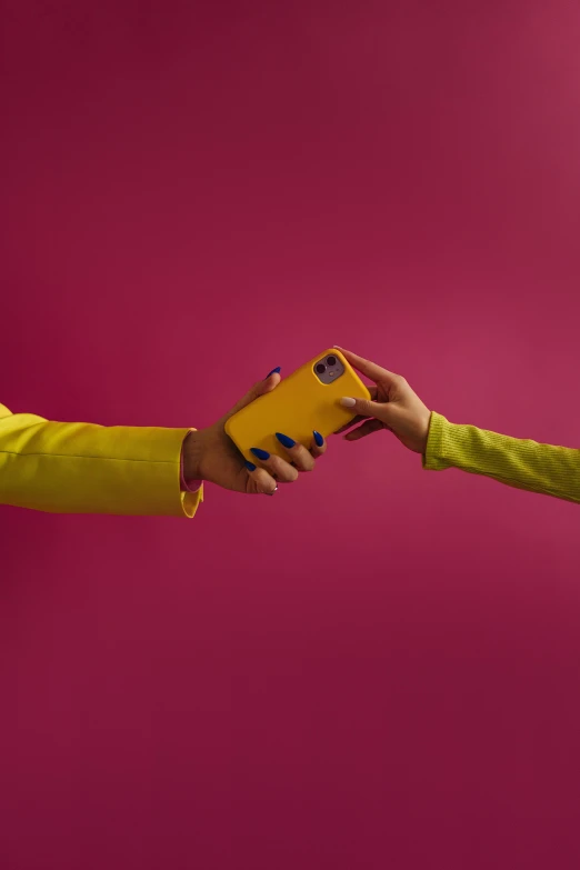 a person handing something to another person in a yellow jacket, by Gavin Hamilton, beautiful cameraphone, pink and yellow, product shoot, case