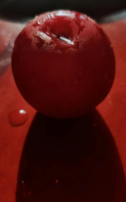 a red apple sitting on top of a red table, reddit, hyperrealism, candle dripping wax, iphone photo, spherical body, red!! sand