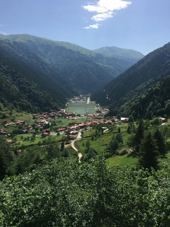 a valley with a small village in the middle of it, profile image, georgic, in the center of the image, image