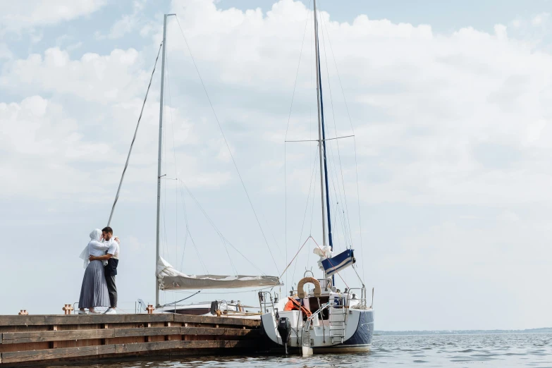 a man standing on a dock next to a sailboat, happening, wedding, awkward situation, fan favorite, ignant