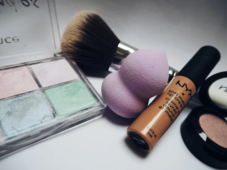 a close up of cosmetics and a brush on a table, pexels contest winner, hyperrealism, pastel palette silhouette, cute complexion, bulbous, modelling