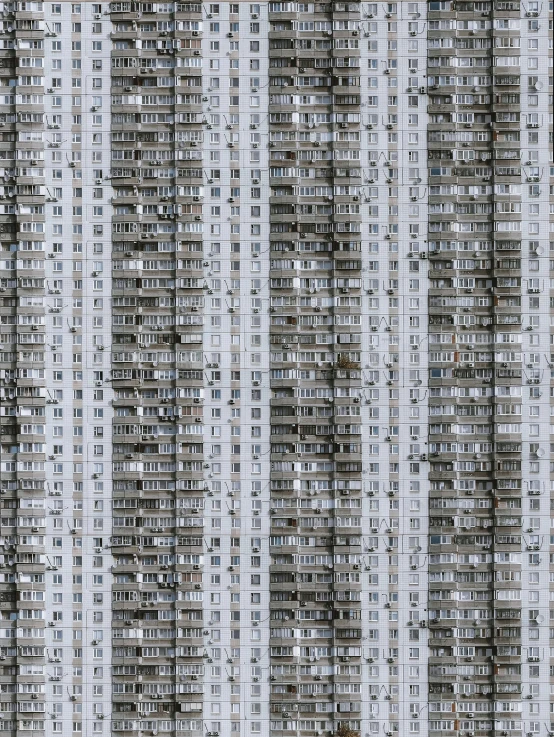 a very tall building with lots of windows, inspired by Andreas Gursky, soviet suburbs, pc screen image, danila tkachenko, grey