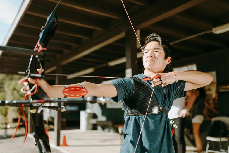 a man that is holding a bow and arrow, pexels contest winner, local gym, sydney park, avatar image, darren quach
