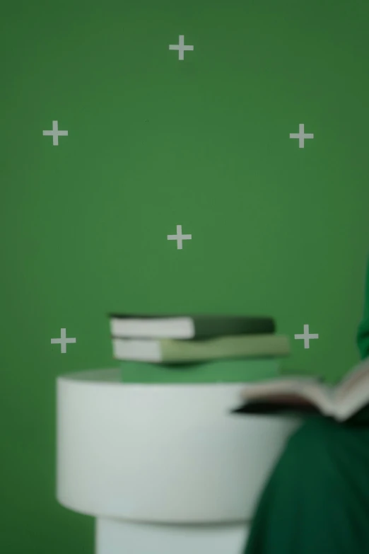 a person sitting on a toilet reading a book, a minimalist painting, inspired by Art Green, trending on polycount, wall ], crosses, green screen, detail shot