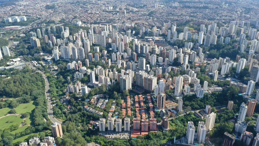 an aerial view of a city with lots of tall buildings, by Felipe Seade, graffiti, skyscraper forest community, ap