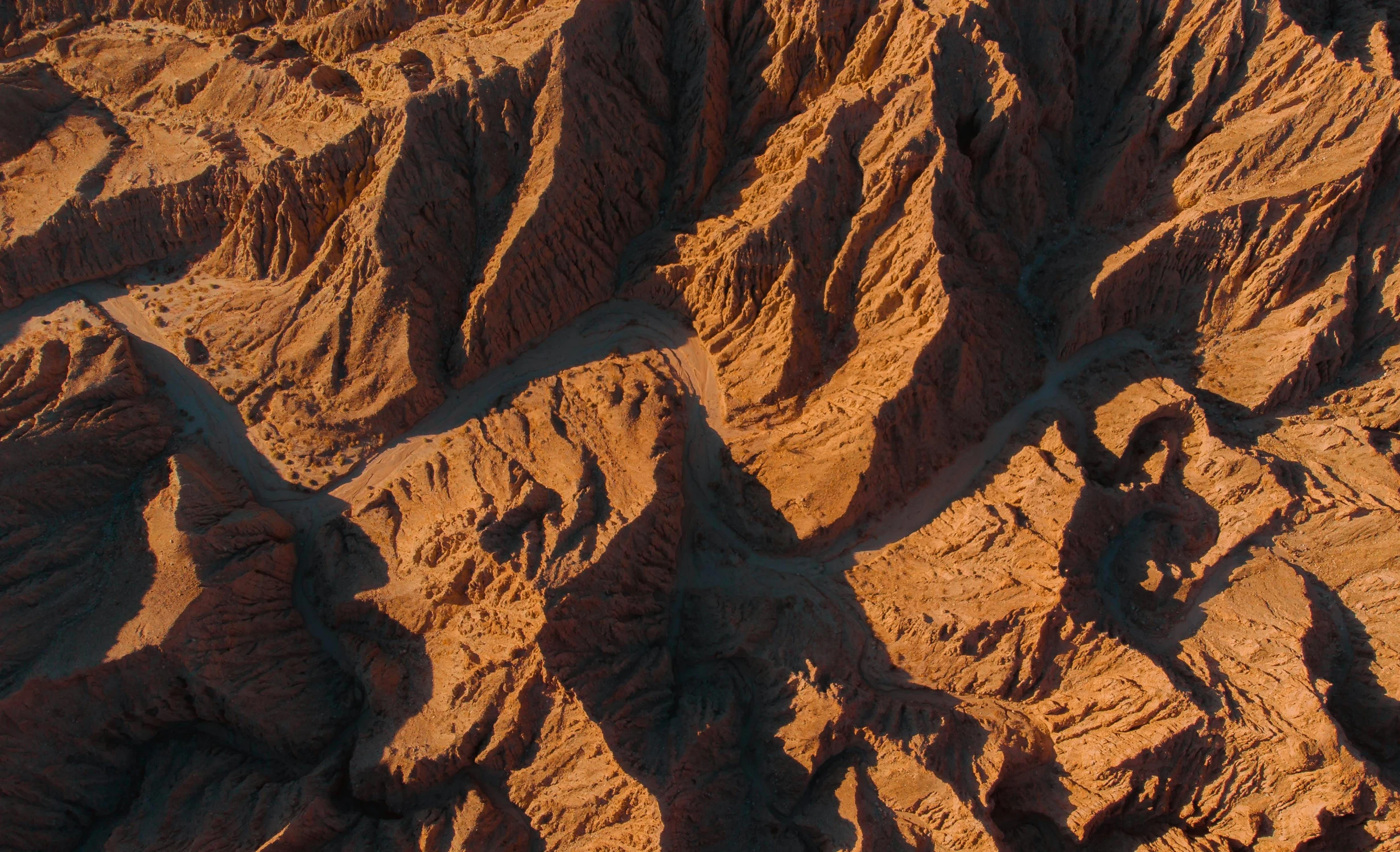 a group of people standing on top of a mountain, by Filip Hodas, canyon topography, close-up from above, pbr materials, the australian desert