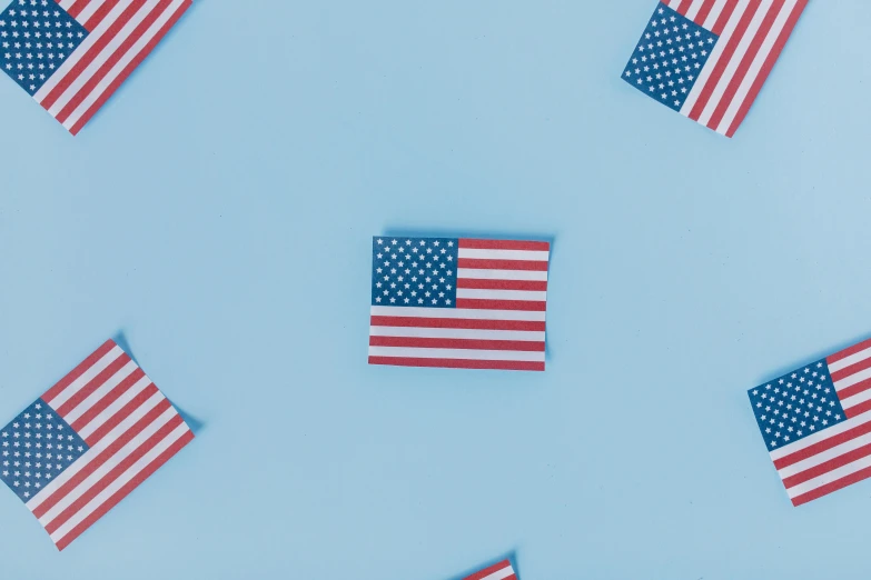 a pattern of american flags on a blue background, an album cover, pexels contest winner, floating objects, background image, minimalistic aesthetics, profile picture