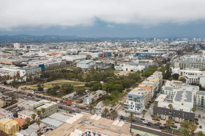a view of a city from the top of a building, unsplash, photorealism, santa monica beach, bjarke ingels, 4k photo gigapixel, aerial view
