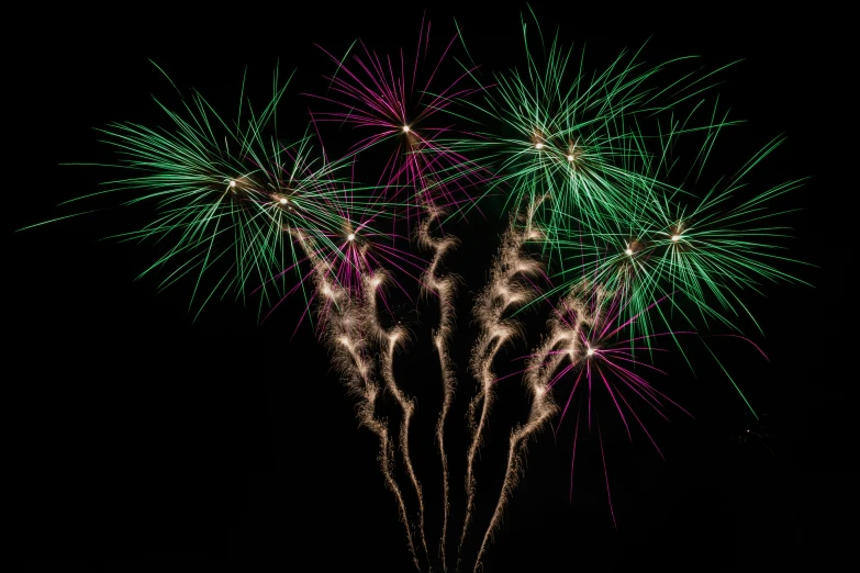 a bunch of fireworks that are in the sky, a digital rendering, pexels, hurufiyya, purple and green fire, medium close shot, thumbnail, vibrant colour