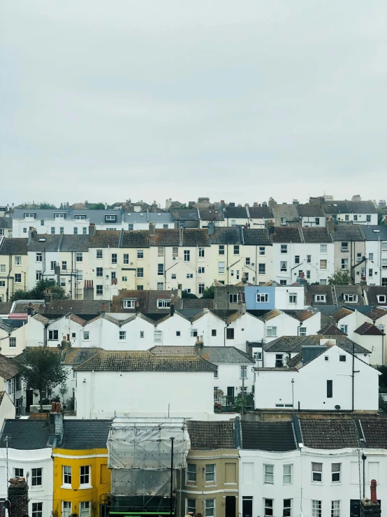 a view of a city from the top of a hill, seaside victorian building, white buildings, jen atkin, 8 5 mm photograph