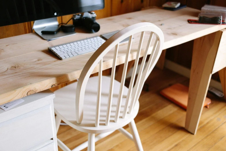 a computer sitting on top of a wooden desk, pexels contest winner, arts and crafts movement, white apron, tables and chairs, devon cady-lee, white clay