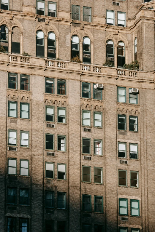 a very tall building with lots of windows, by Adam Rex, pexels contest winner, rundown new york apartment, vintage shading, brown, promo image