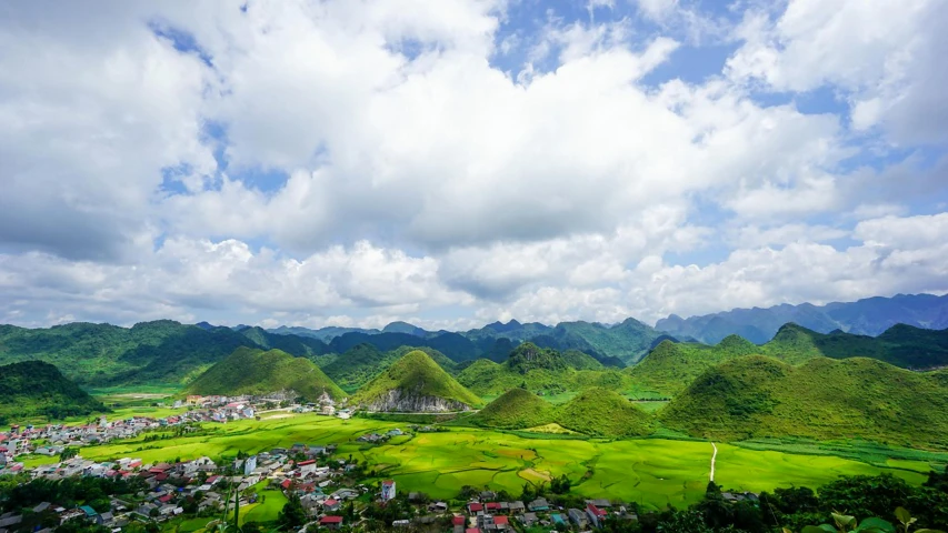 an aerial view of a village in the mountains, pexels contest winner, vietnam, blue sky and green grassland, white, youtube thumbnail